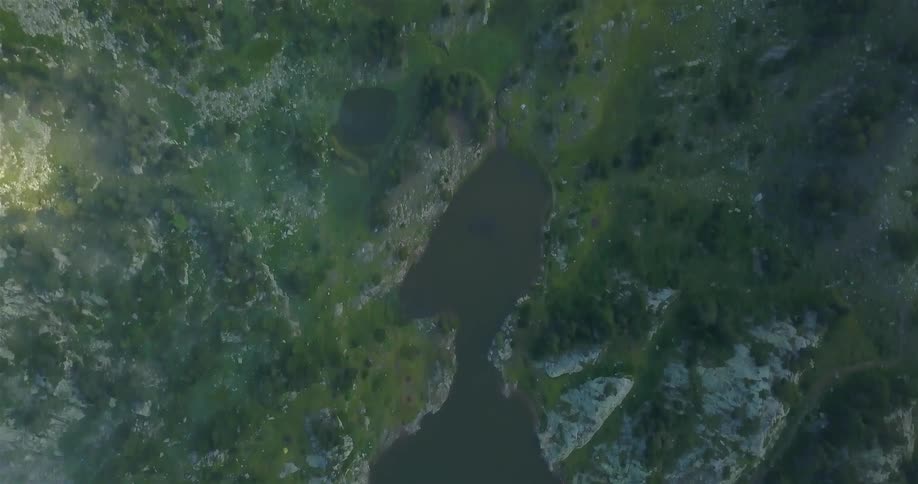 A body of water sits between these mountains