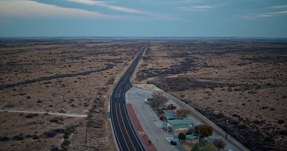 A road that passes a rest area has fresh asphalt