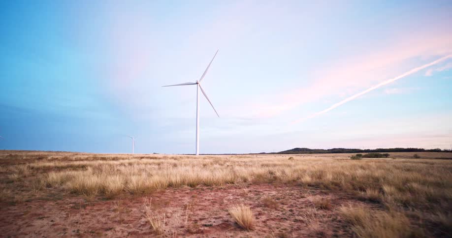 Wind turbine spinning in a rural field