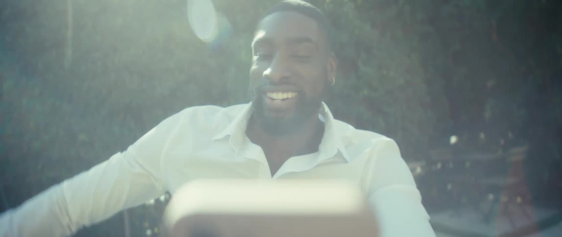 The man spins his cell phone camera around the yard as he talks