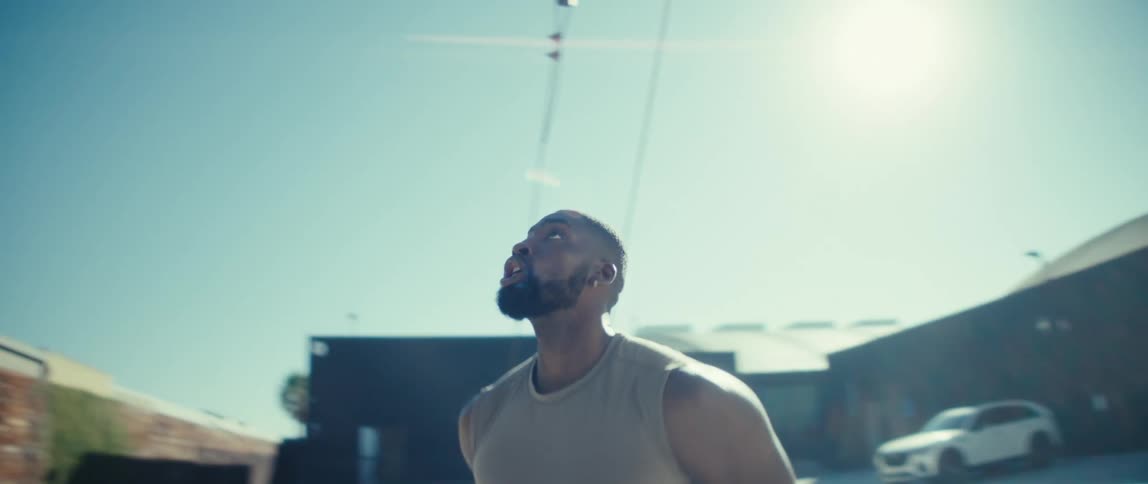 Player running with a basketball outdoors
