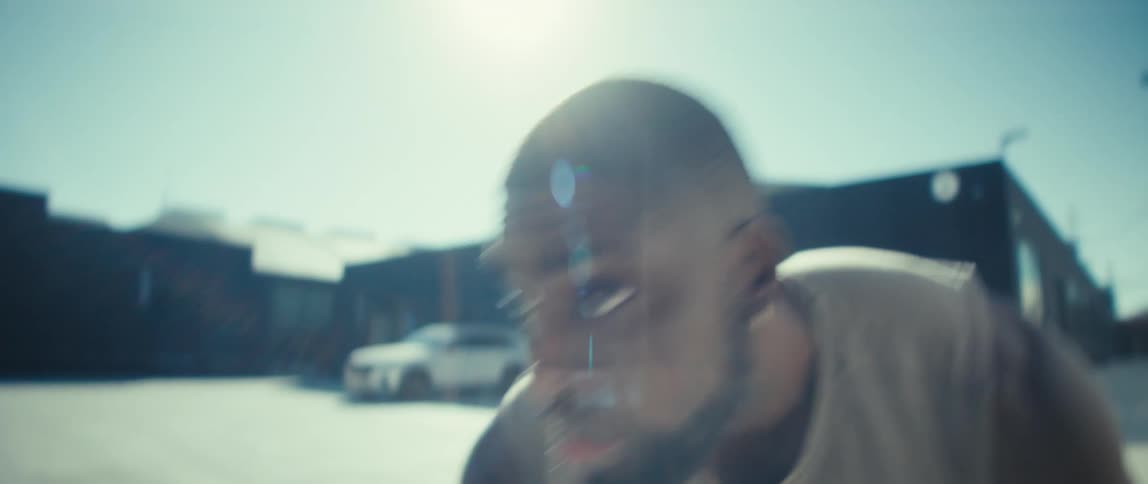 A man playing basketball outdoors