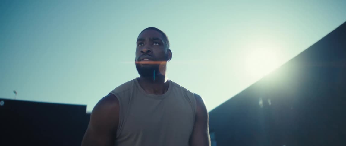A man with a basketball outdoors