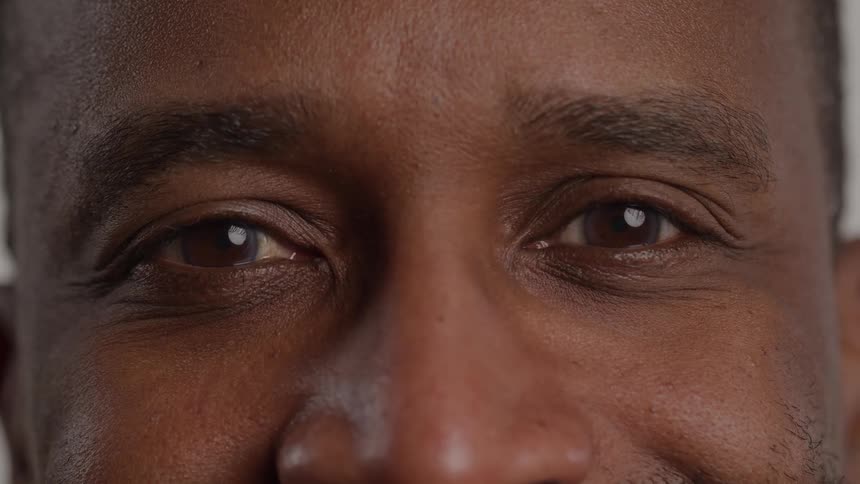 Eyes of a small group of people appearing one person at a time indoors