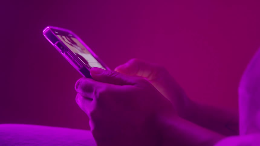 A person scrolling on a smartphone