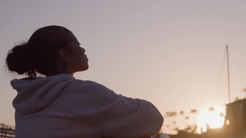 A girl outside at dusk
