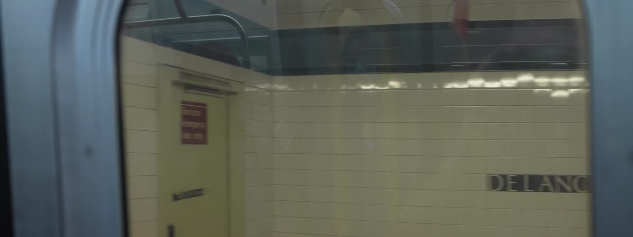 Window view from the interior of a moving train in a metropolitan city subway