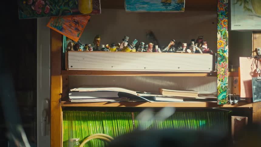 Tubes of paint fill the shelf