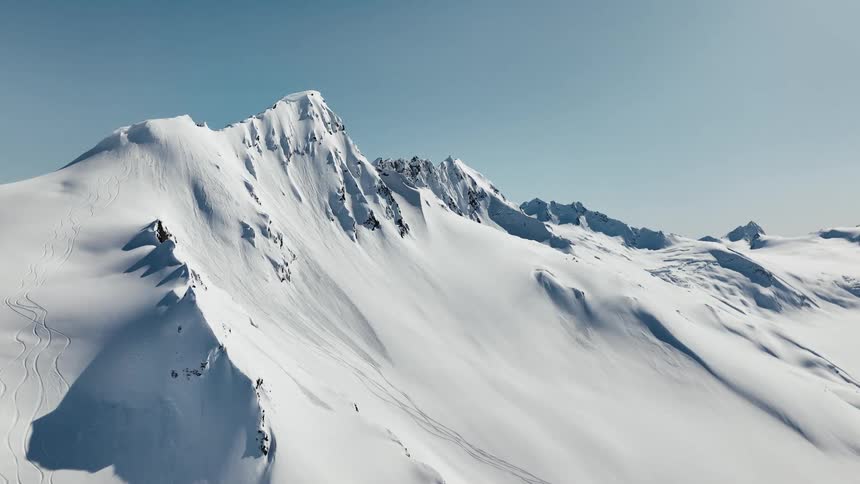 A view of a mountain range covered in snow
