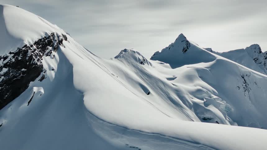 A view of a mountain range covered in snow