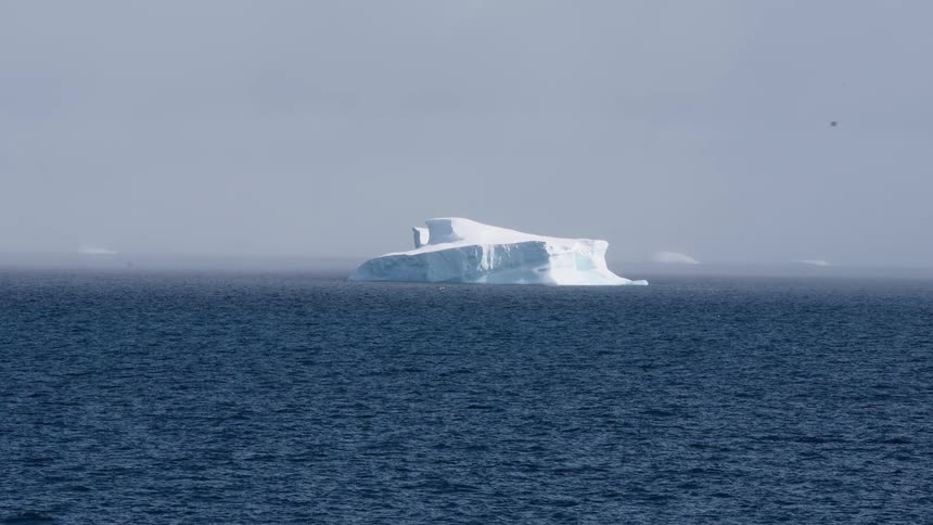 A view of an iceberg out in the ocean