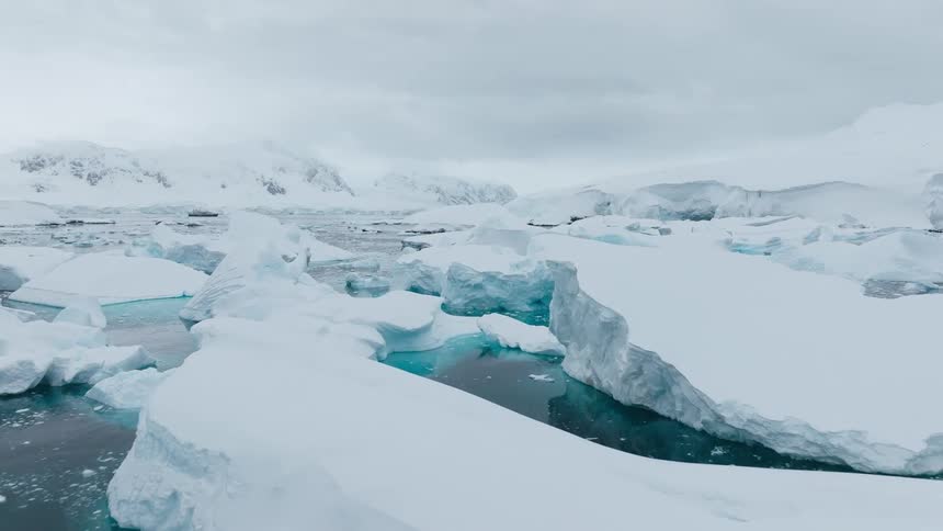 An aerial view of ice floating in the ocean