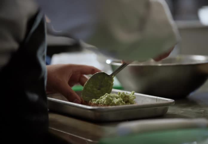 A person making food at a restaurant