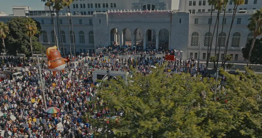 A large demonstration is happening in a city park