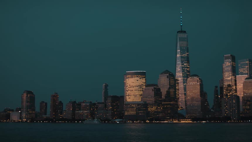 Modern towers and skyscrapers on the metropolitan coast as boats sail on the water
