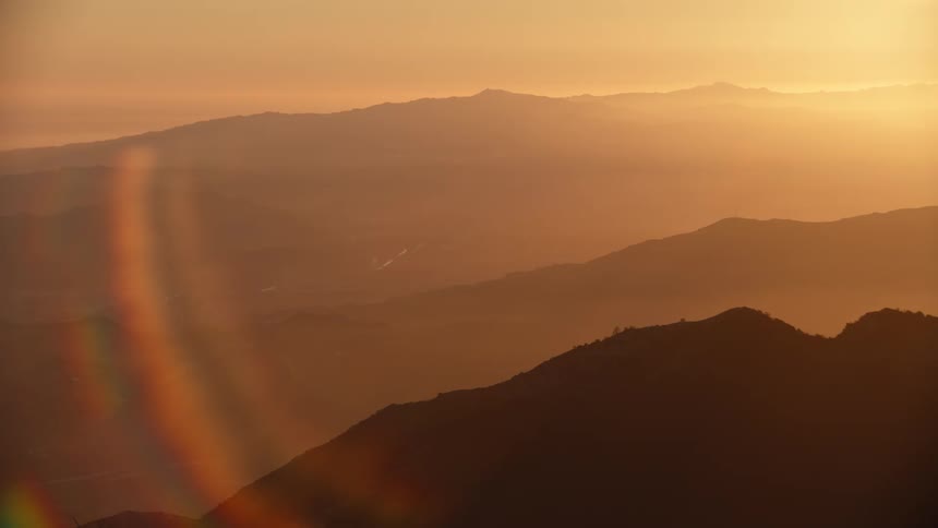 Sunlight paints the mountains