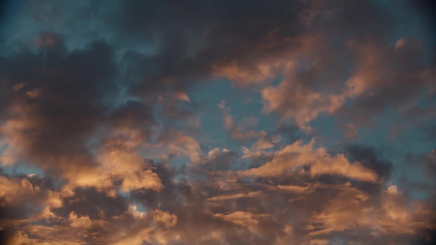 A view of clouds changing colors at sunset