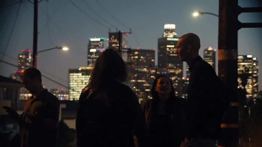 A group of friends outdoors in a city