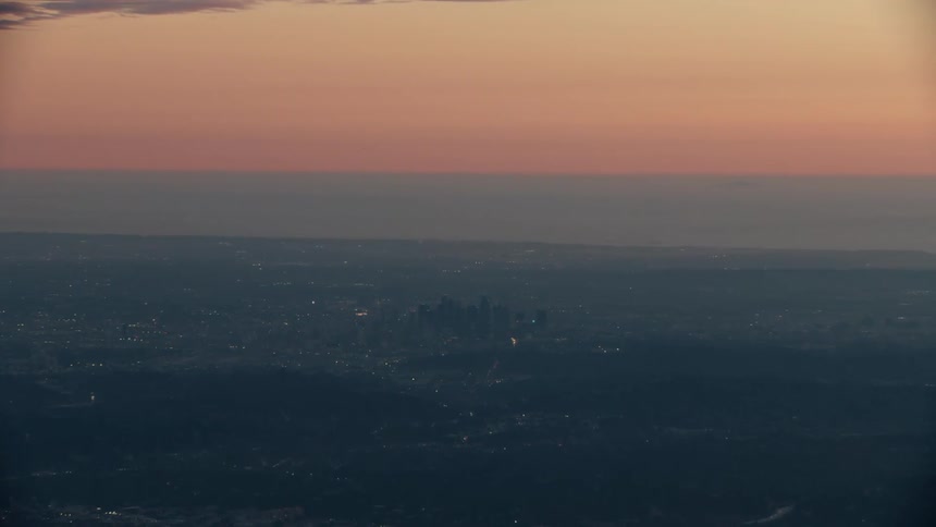 A view of the sun setting over a city