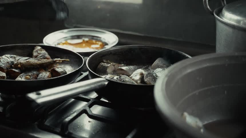 People cook together at home during the daytime