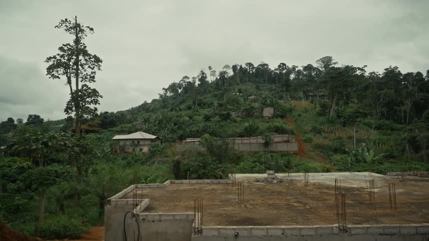 An uncompleted building foundation in a rural area during daytime