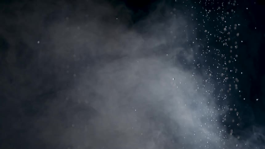 Water rains down on the smoke
