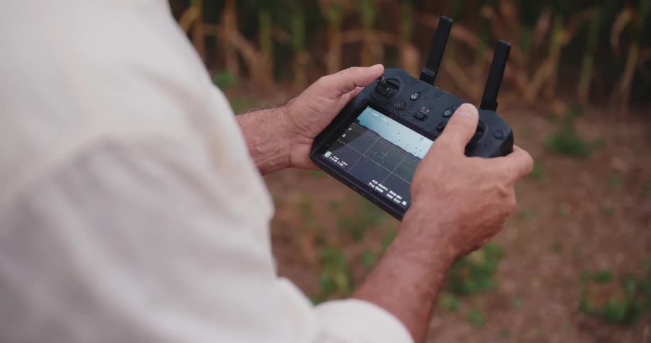 Man holds the remote controller for a drone in his hands