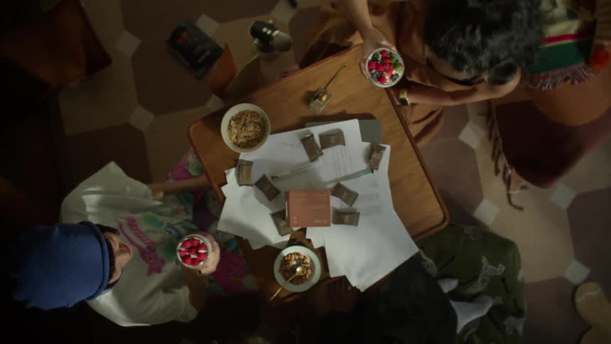 Friends toast their cups of fruit