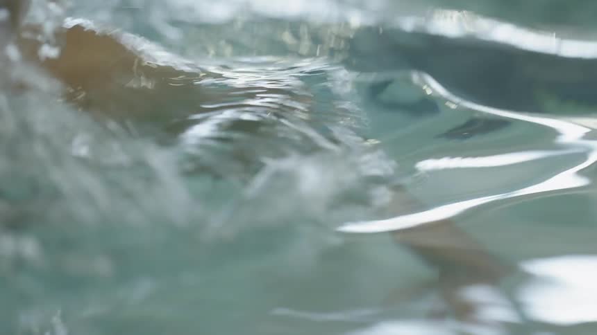 A woman is swimming in the water