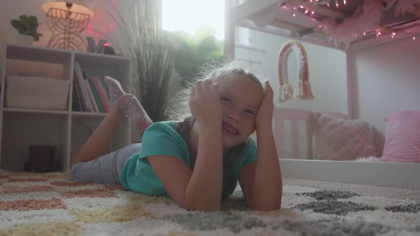 A girl laying around in a room
