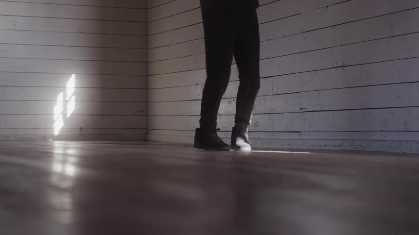 Person jumping rope in a sunlit room