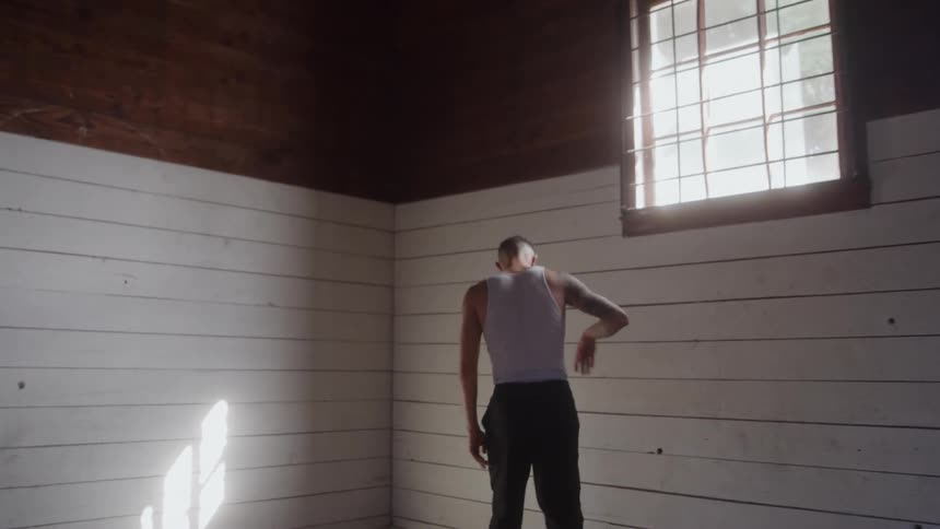 Aman takes his jacket off and throws it on the floor as he places his hands on the back of his head pacing angerly in a gym