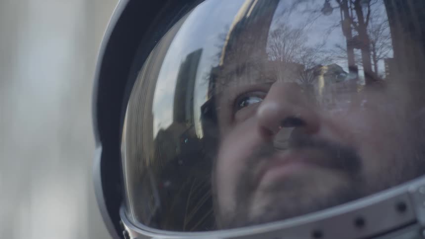 Close up of man wearing helmet over his head