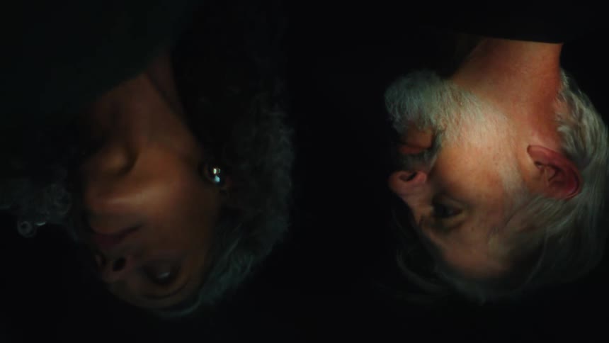 A reflection of a man and woman in water