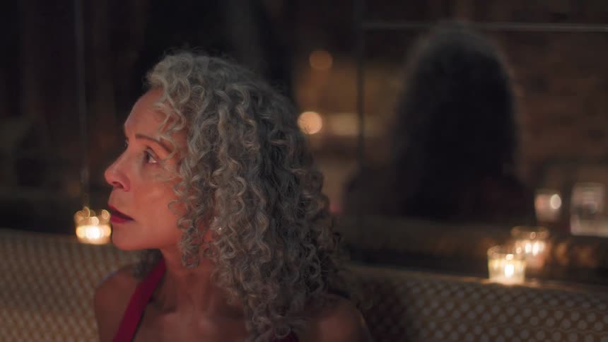 A woman sitting at a table talking