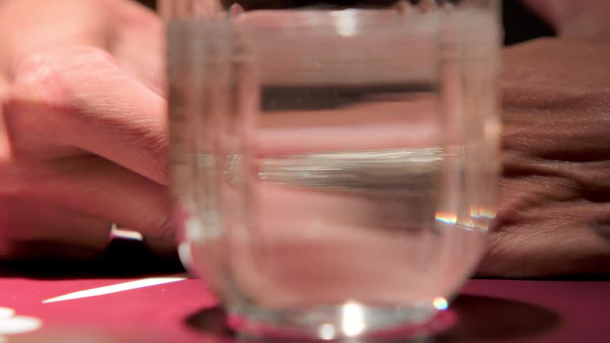 A woman putting a ring on her finger