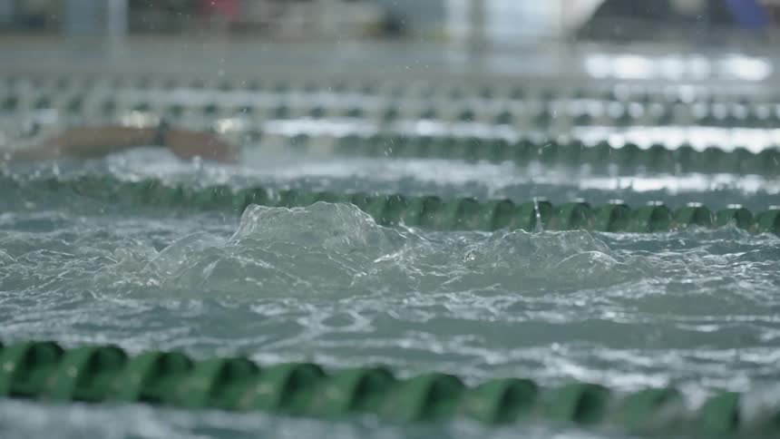 People swim in a large pool