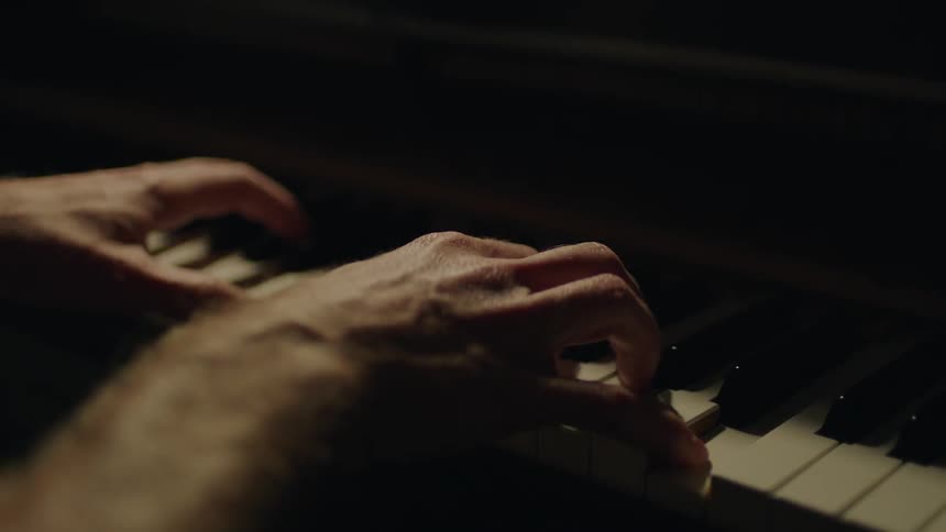 Person playing a piano