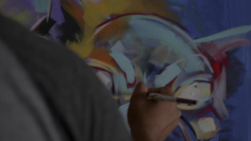 Person paints a large mural