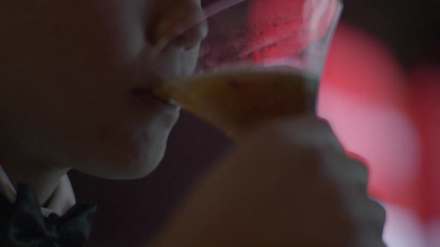 People are at a bar with drinks