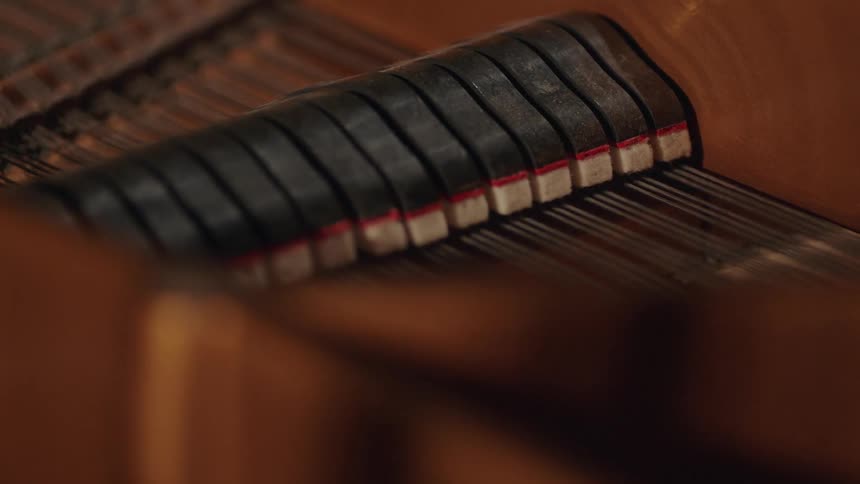 The inside of a piano while it's being played