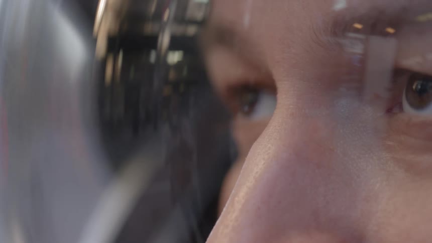 A man is looking up through a helmet glass