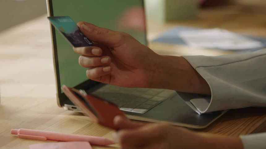 A person taking out a credit card