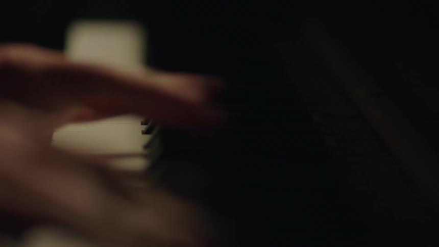 A person is playing the piano