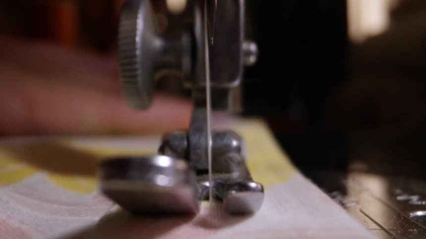 A sewing machine working on fabric