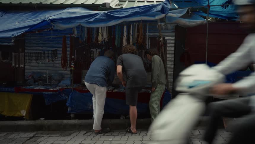 A group of people outdoors at a market