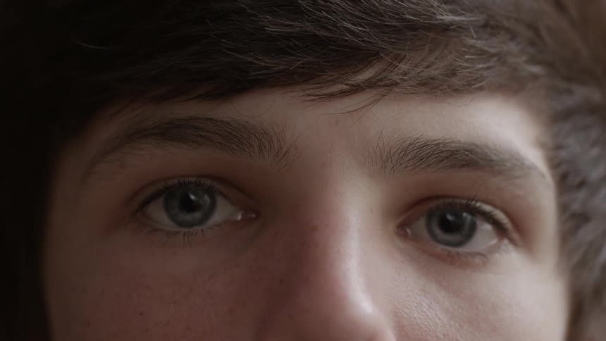 A man is looking forward eyes wide open