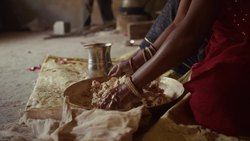 A person making food in a bowl
