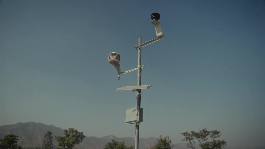 The pole has sensors and a solar panel on it