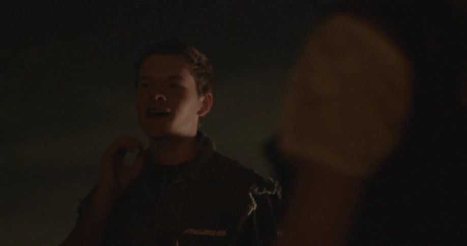 A man is talking to someone at night